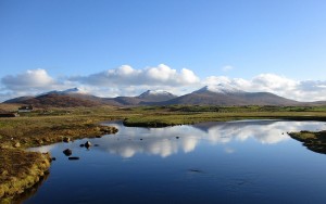 The hills of South Uist from the Howmore Bridge. With thanks to Rupert Fleetingly and the Geograph licence.